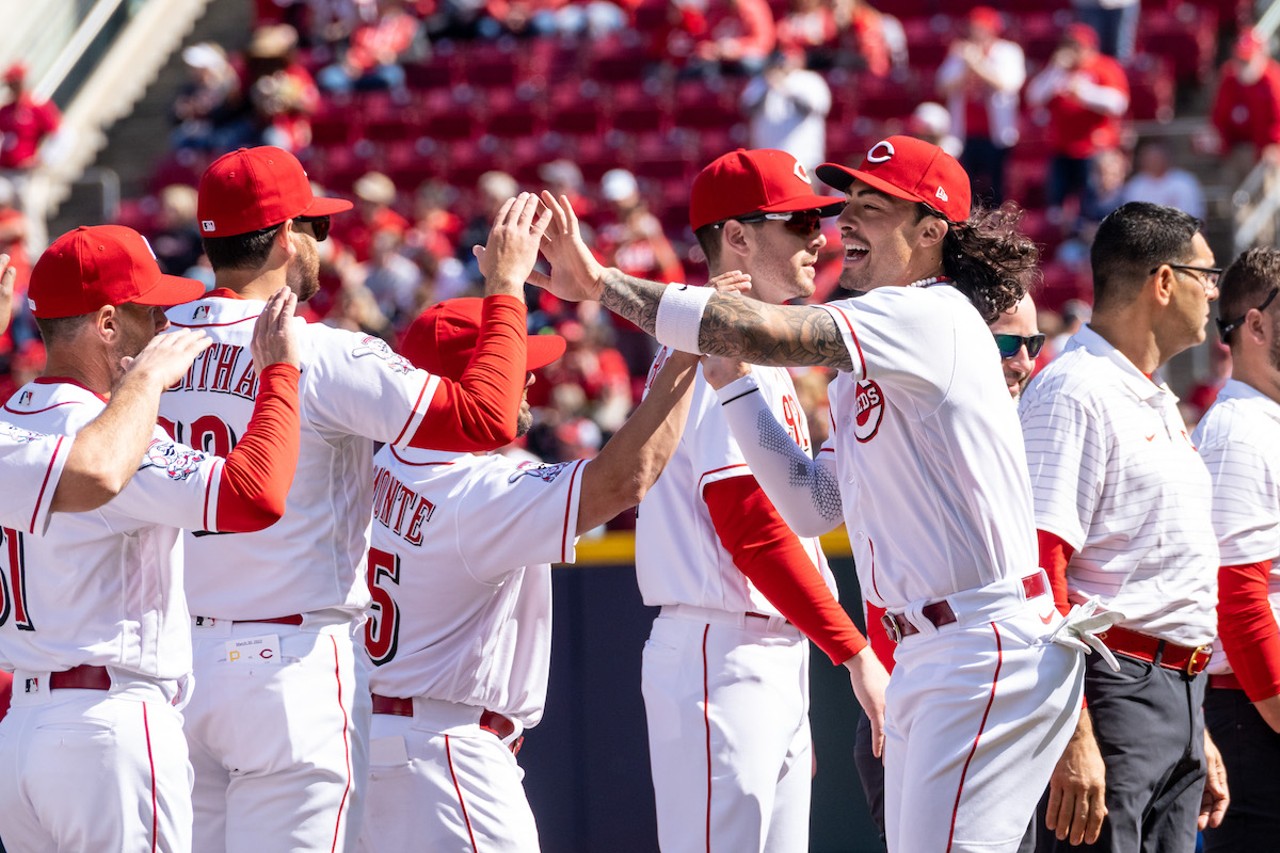 Cincinnati Reds second baseman Jonathan India (right) celebrates with teammates during the season opener at Great American Ball Park on March 30, 2023.
