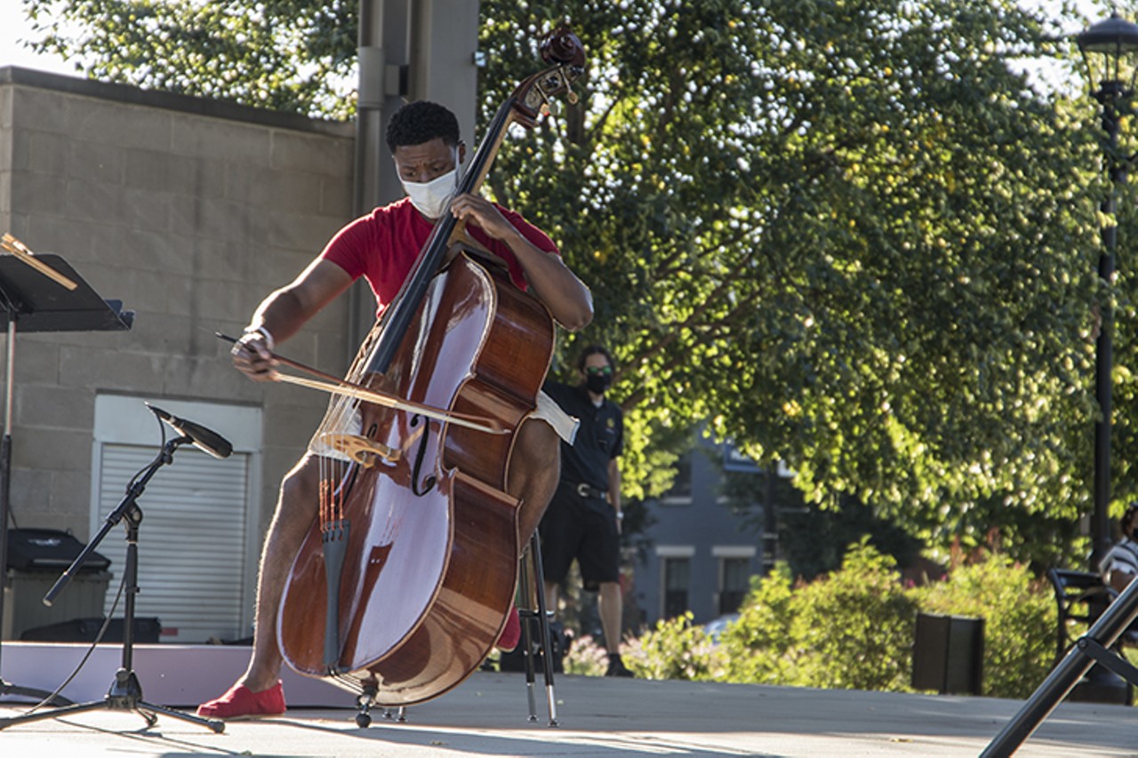 Cincinnati Symphony Orchestra fellow Ian Saunders performs a rendition of "Amazing Grace" for attendees at a  vigil for Elijah McClain in Washington Park July 12