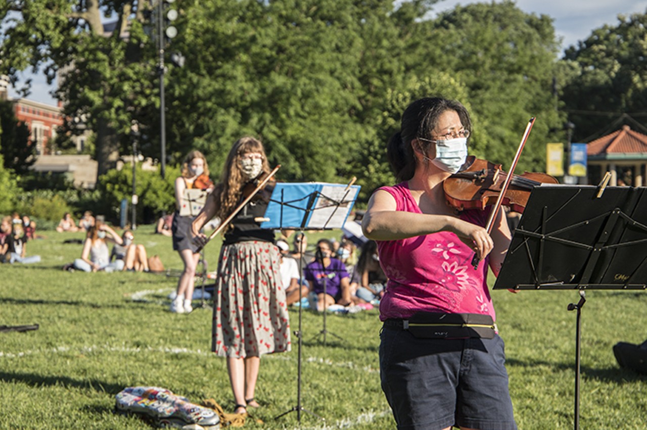 Musicians play during a vigil for Elijah McClain July 12 in Washington Park