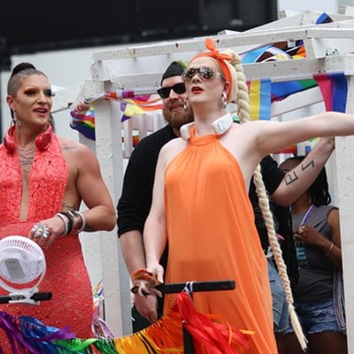 Two people at the front of their float at Cincinnati Pride Parade on Saturday, June 22, 2024.