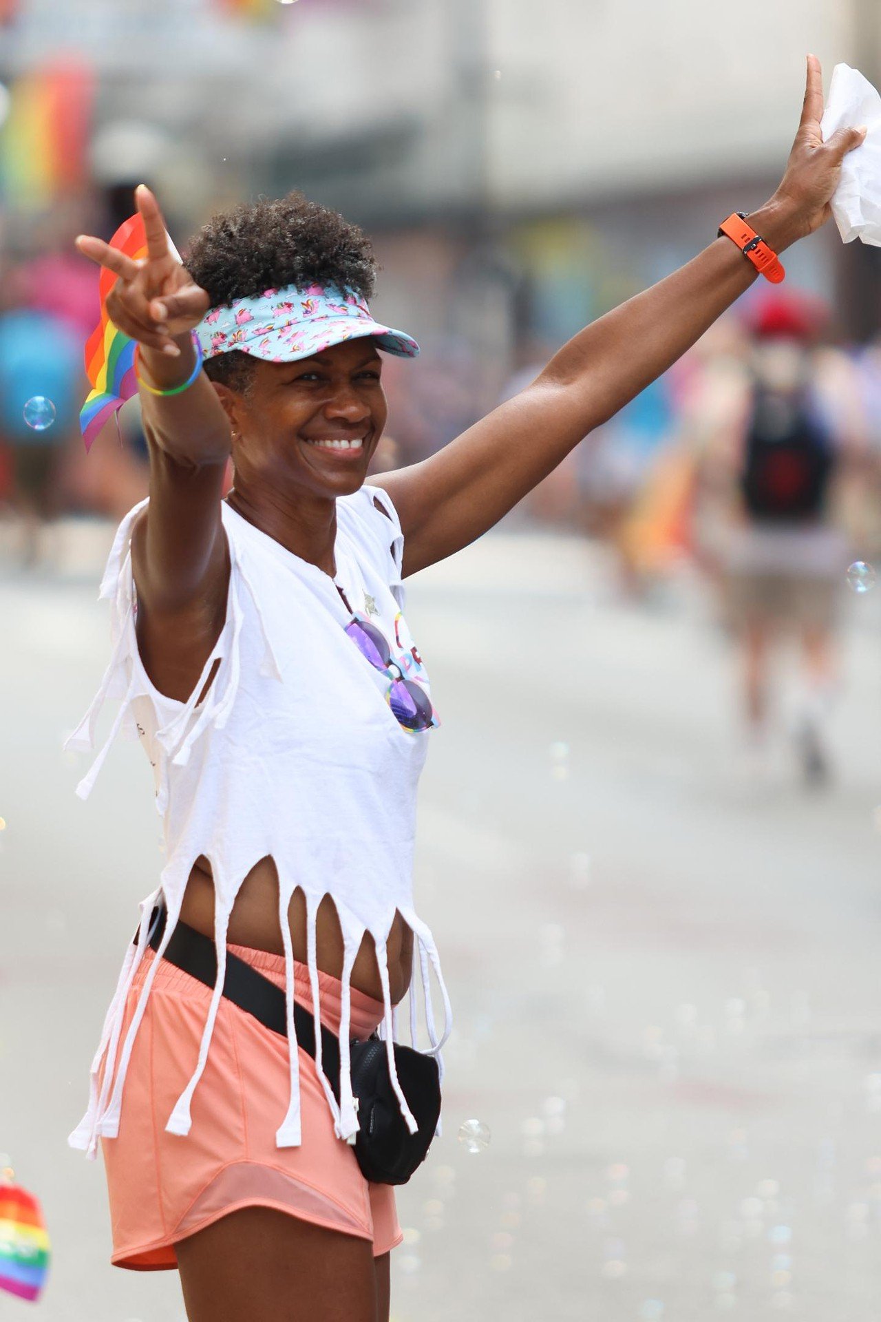 A spectator cheers as floats pass at Cincinnati Pride Parade on Saturday, June 22, 2024.