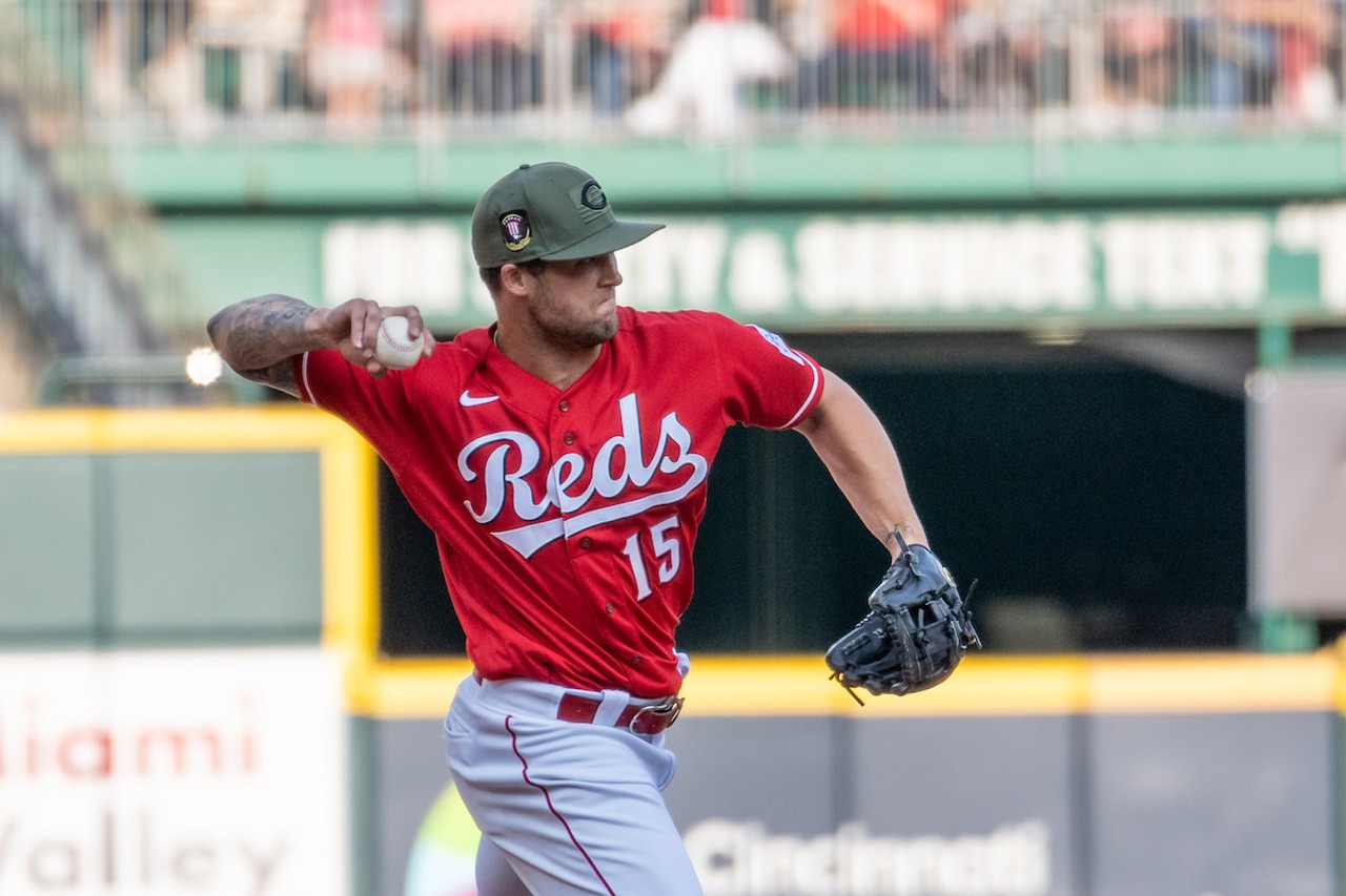 Nick Senzel throws to first base during the ninth inning of the Cincinnati Reds game on May 20, 2023.