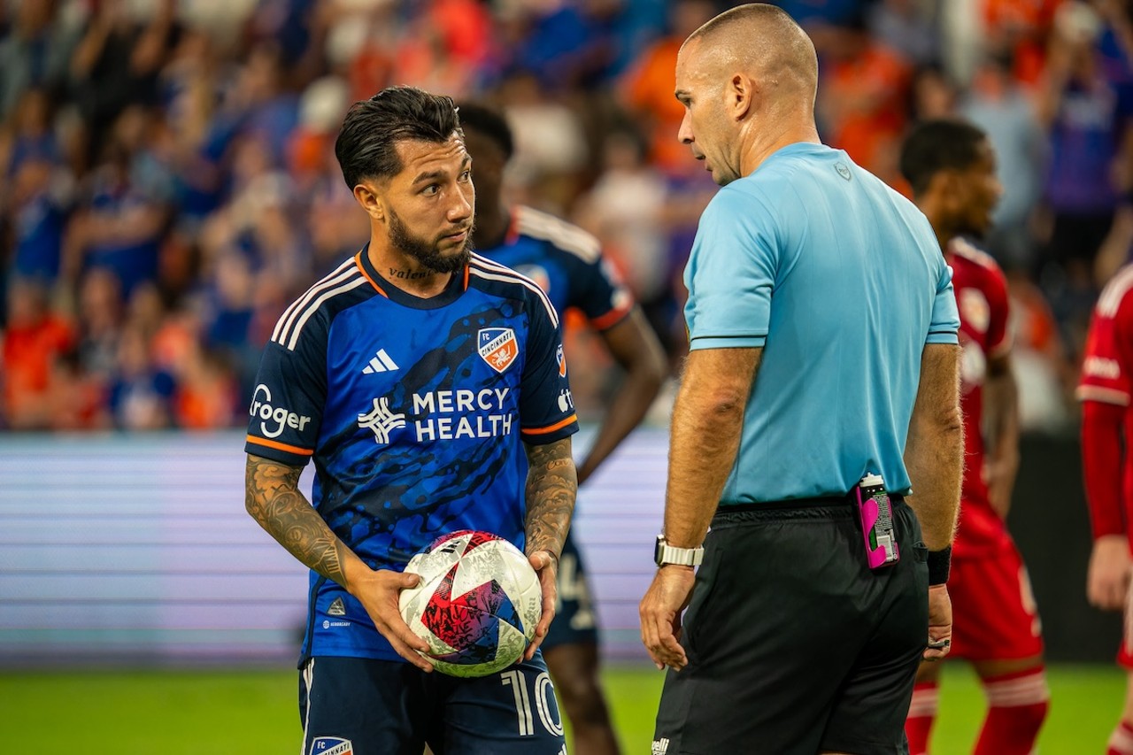 Luciano Acosta converses with the referee before taking a penalty kick | FC Cincinnati vs. New York Red Bulls | Oct. 4, 2023