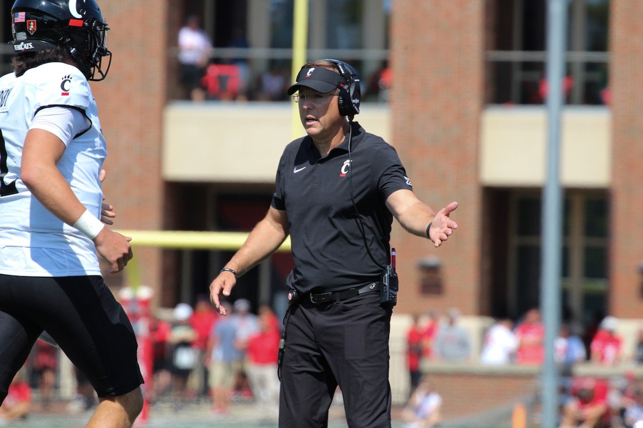 UC head football coach Scott Satterfield congratulates UC quarterback Brendan Sorsby.