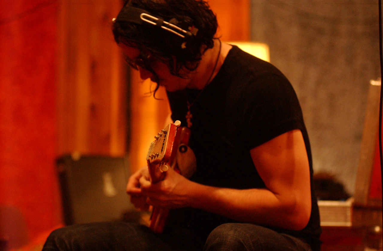 Jack White overdubbing guitar for The White Stripes' cover of the Greenhornes song, “Shelter of Your Arms,” which was released as a B-side.