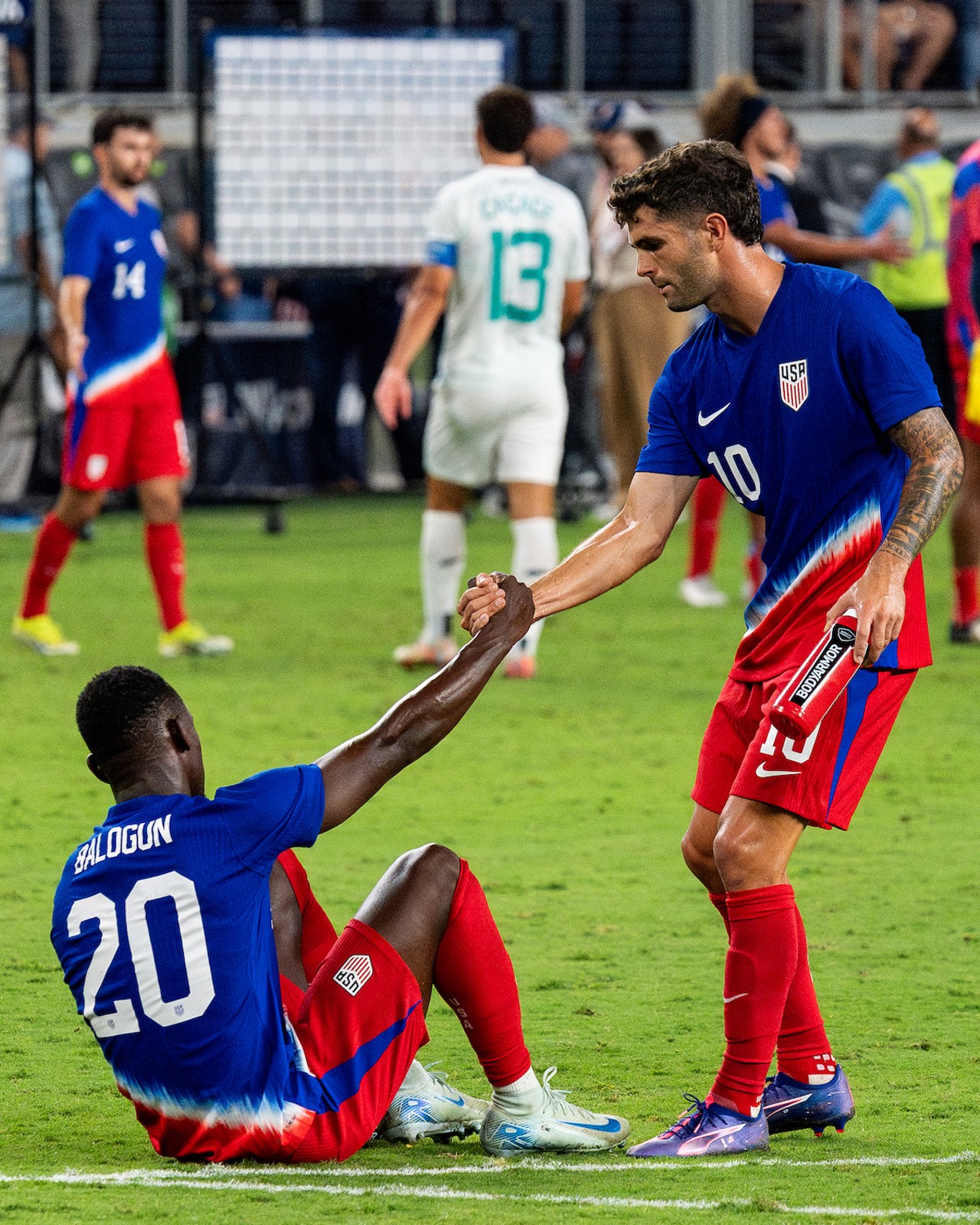 Christian Pulisic consoles Folarin Balogun after a late equalizer from New Zealand.