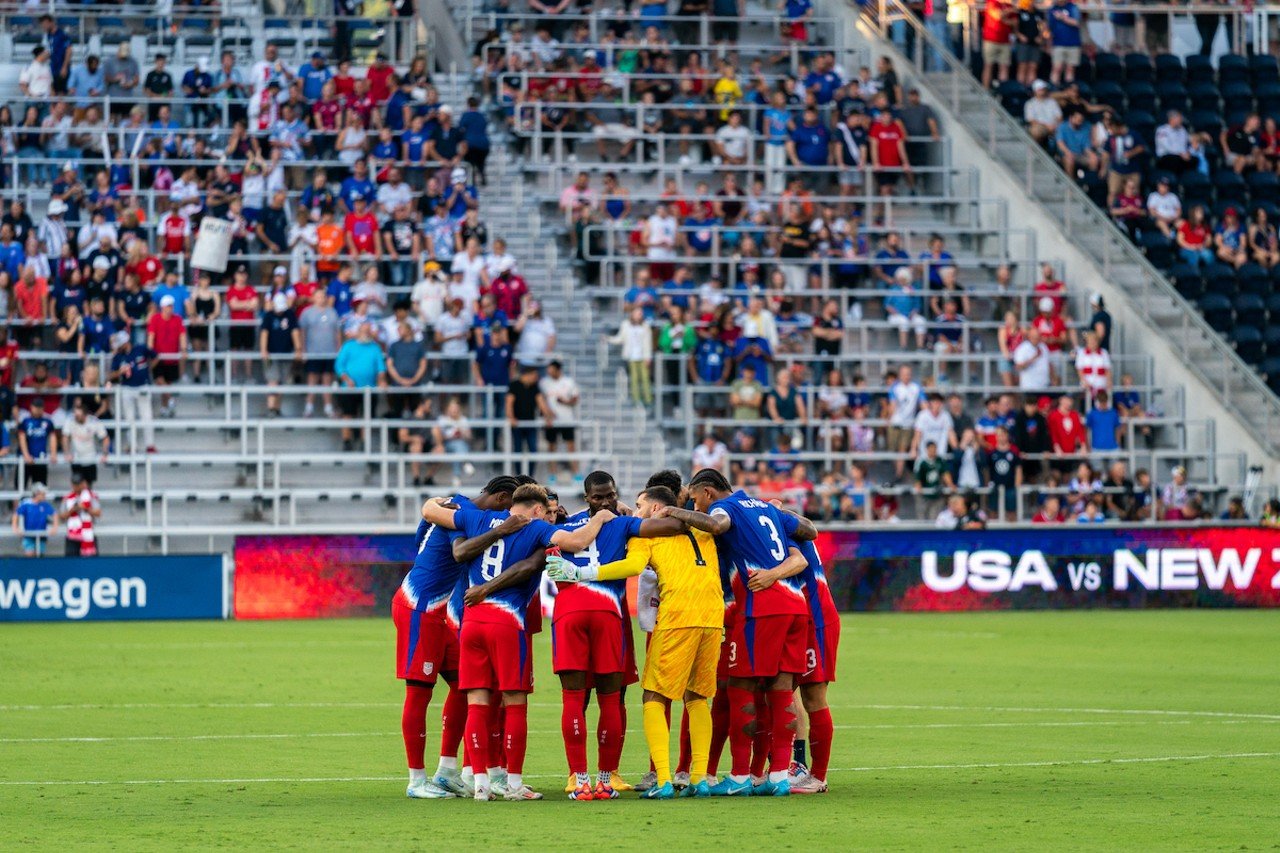 USA huddles before kickoff.