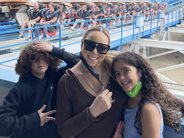 Mariah Carey posing in front of Gatekeeper at Cedar Point