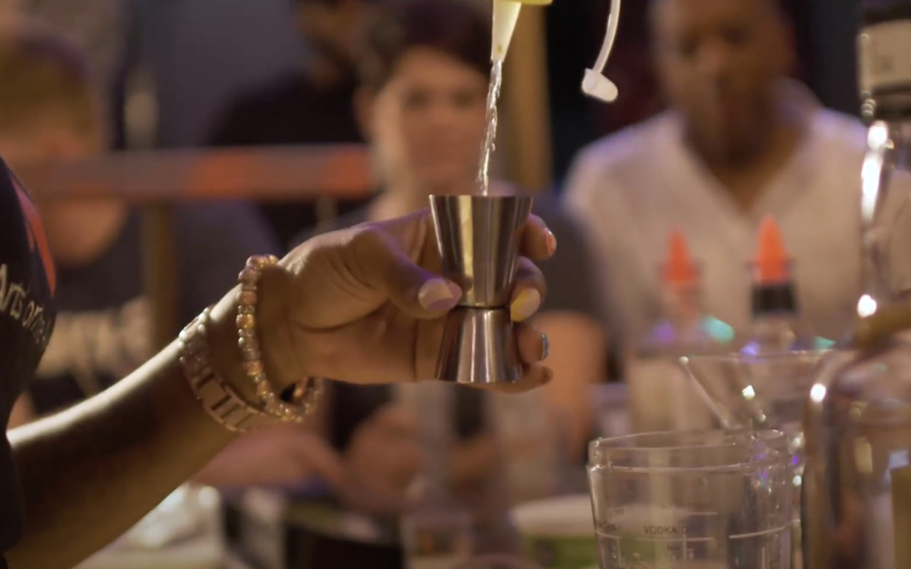 A bartender mixes a drink at Cincinnati Alchemy Fest 2022.