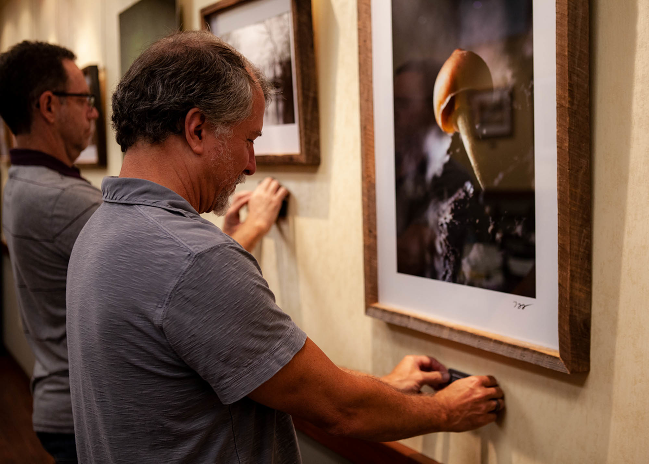 T.J. Vissing and Rick Conner prepared their gallery and put final touches on the frames.