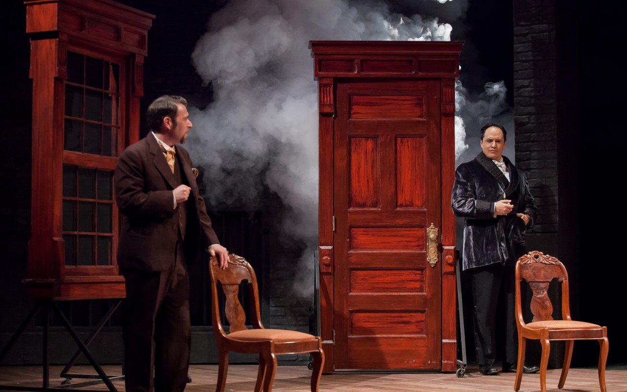Holmes (Ravael Untalan) and Watson (Jacob James) ponder a mystery in "Baskerville" at the Cincinnati Playhouse