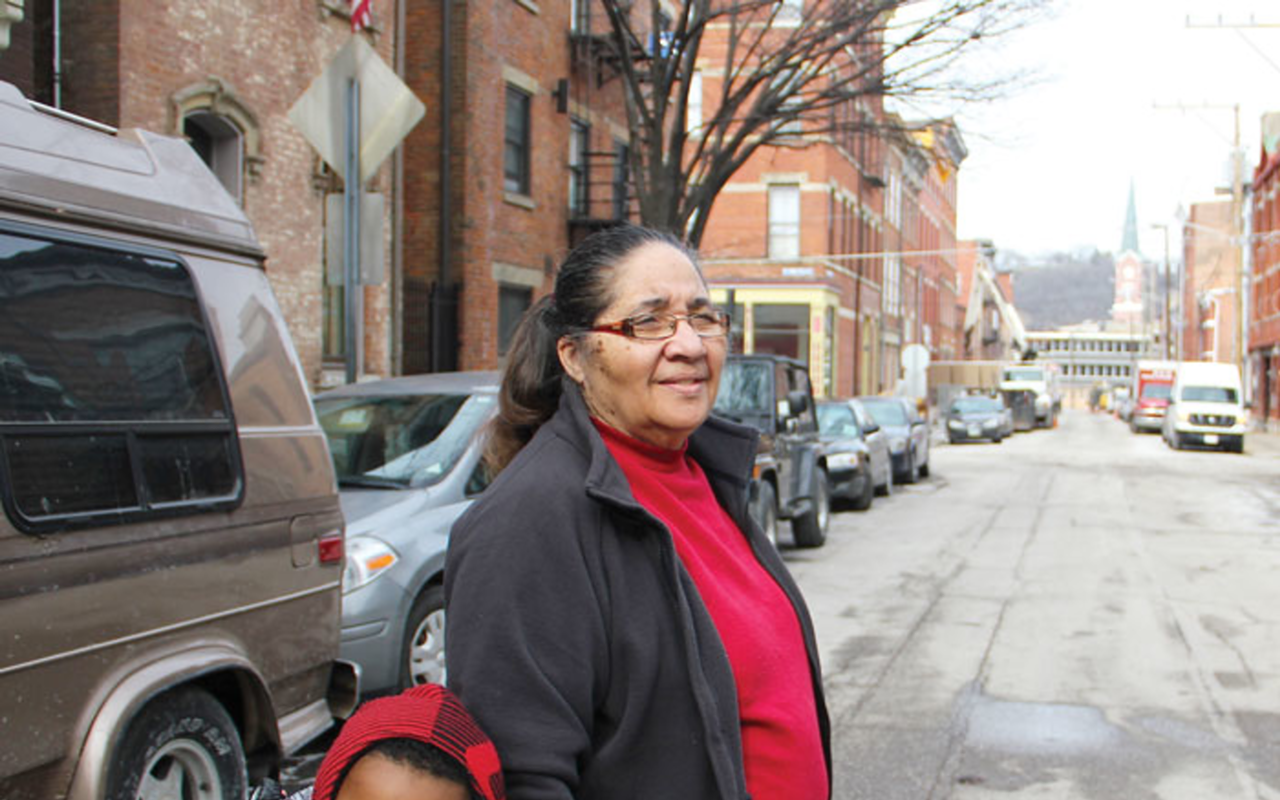 Georgia Keith and her grandson cross Republic Street. The 51-year resident of OTR has struggled with parking in recent years because of development in the neighborhood.