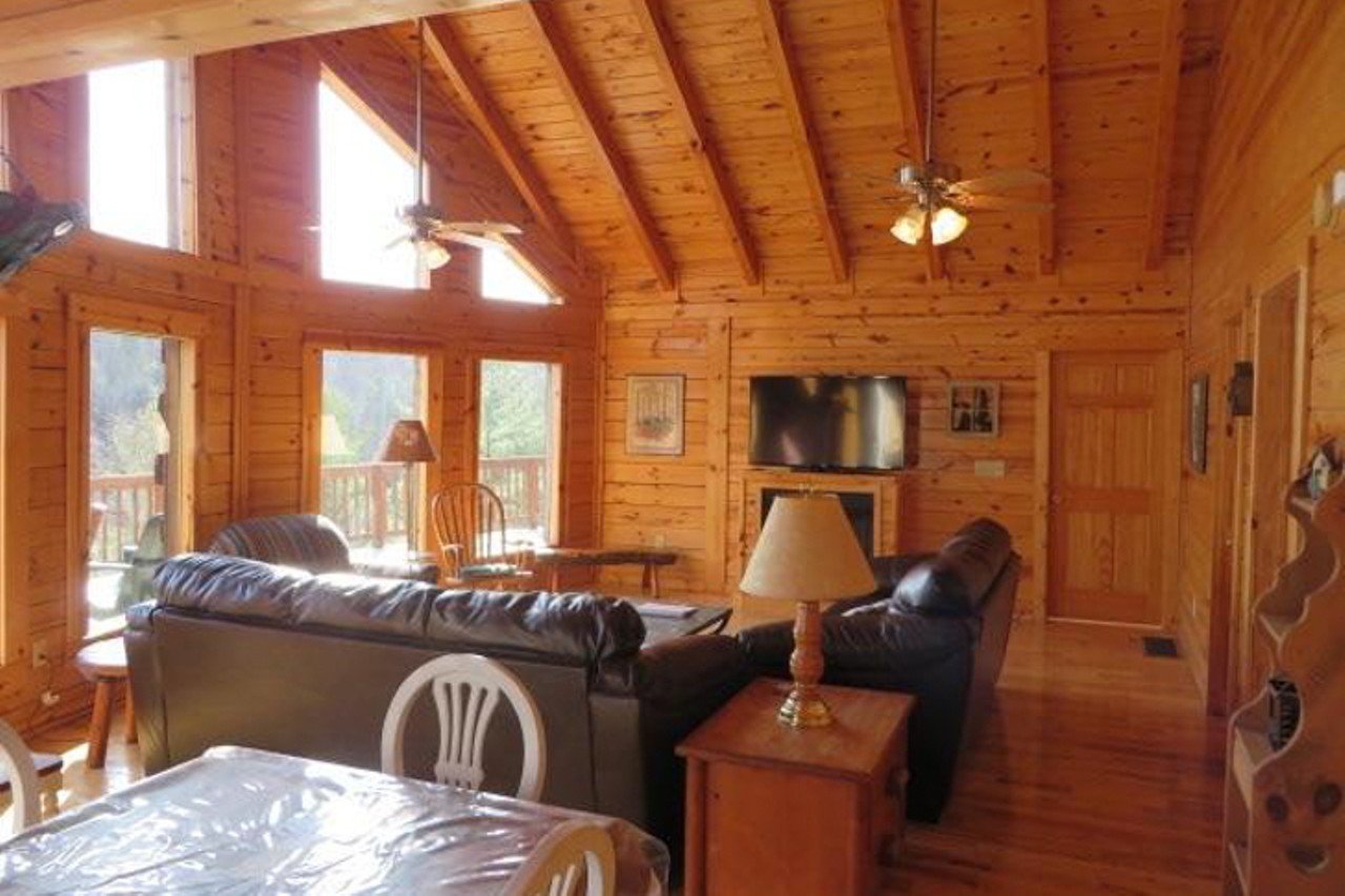 Living On The Edge
Red River Gorge, Kentucky
From $300/night | Hosts 13 guests
"As the name suggests, it is located on the edge of a cliff (well, a good 60-70 feet away). This large, 2,200 sq. ft., cabin is perfect for folks wanting to get away while still enjoying the comforts of home. It features 5 bedrooms, 3 bathrooms and a deck that overlooks the cliffline. Living on the Edge offers ample space to: relax in the Jacuzzi hot tub on the back deck, play a game of pool or foosball, snuggle around one of the two fireplaces, unwind around the fire pit or enjoy a meal at the picnic table." &#151; Red River Gorge Cabin Rentals 
Photo via redrivergorgecabinrentals.com
