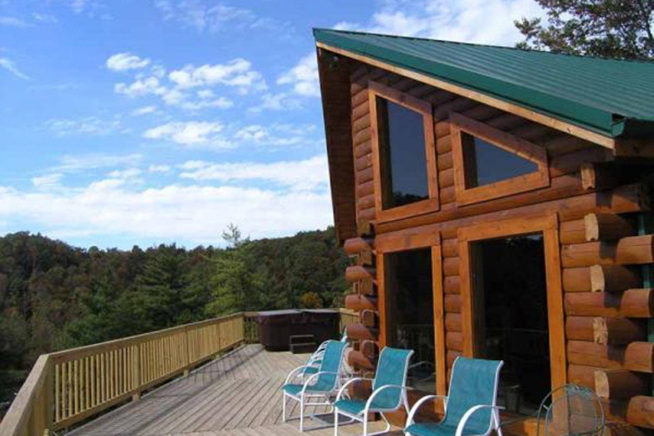 Living On The Edge
Red River Gorge, Kentucky
From $300/night | Hosts 13 guests
"As the name suggests, it is located on the edge of a cliff (well, a good 60-70 feet away). This large, 2,200 sq. ft., cabin is perfect for folks wanting to get away while still enjoying the comforts of home. It features 5 bedrooms, 3 bathrooms and a deck that overlooks the cliffline. Living on the Edge offers ample space to: relax in the Jacuzzi hot tub on the back deck, play a game of pool or foosball, snuggle around one of the two fireplaces, unwind around the fire pit or enjoy a meal at the picnic table." &#151; Red River Gorge Cabin Rentals 
Photo via redrivergorgecabinrentals.com