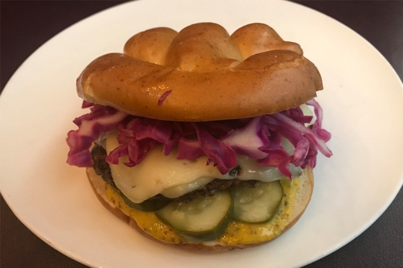 Brown Dog Caf&eacute;
1000 Summit Place, Blue Ash
Brat Burger: A housemade beef bratwurst is served on a pretzel bun with pickled red cabbage, New York white cheddar, a Kaiser pickle, red onion and Brown Dog brat mustard. 
Photo provided by Brown Dog Cafe