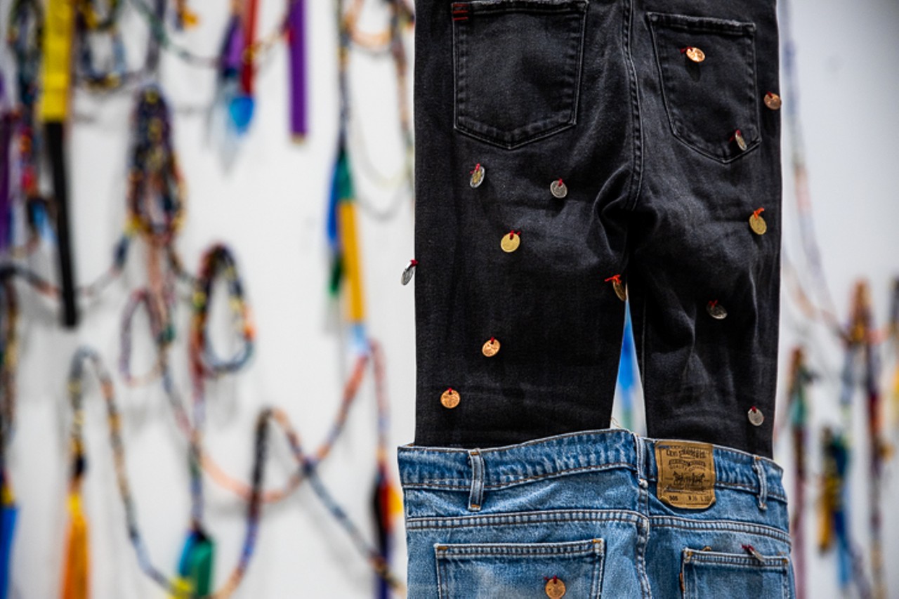"Over and Over" is made with used jeans, thread, coins and rope