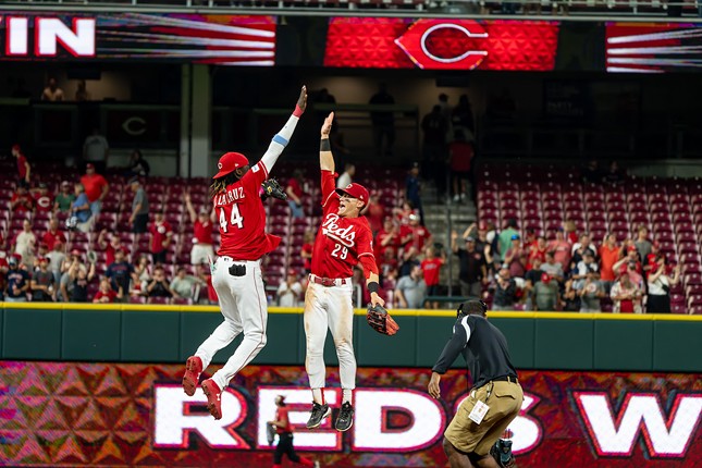The Cincinnati Reds celebrate their win against the Cleveland Guardians on Aug. 16, 2023.