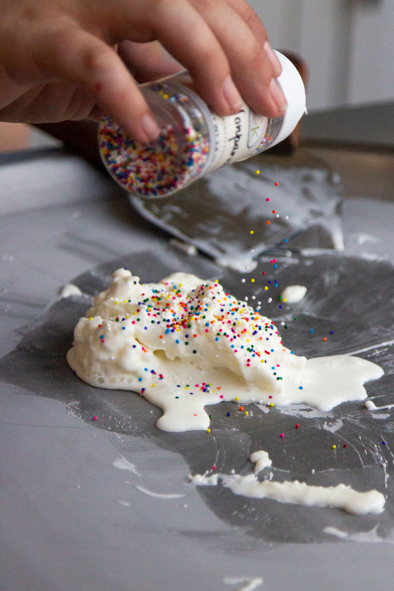 Sprinkles going into the Birthday Cake rolled ice cram