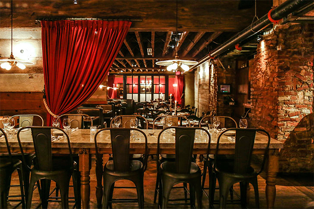 Sotto
118 E. Sixth St., Downtown
Located under Boca restaurant, the Tuscan-inspired Sotto offers an approachable atmosphere and is the perfect place for a romantic meal. The basement trattoria’s interior calls to mind a rustic Italian wine cellar with its rough brick walls and wooden ceiling beams. With multiple dining rooms, the kitchen is open to view, including the custom-made wood-fire grill in front and a fresh pasta room in the back hallway. Menu items include handmade pasta, Salumi & Formaggi (cured meats and cheeses) and big-ticket items like Bistecca Fiorentina, a grilled Creekstone porterhouse steak.