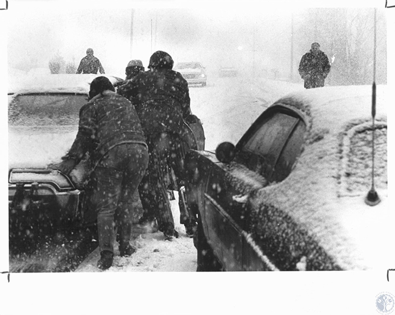Florence
"People shoving cars uphill during snowstorm at US 42 and Gunpowder Road"