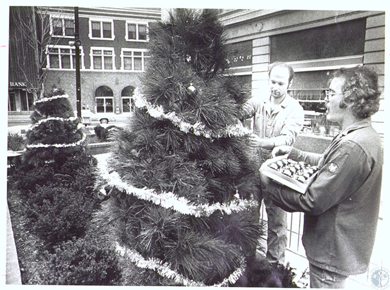 Covington, 1977
"Mike Webrink and Mike Claypoole decorating Christmas Tree in front of Penny's"