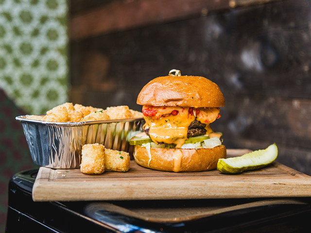 Nation's BIT Burger for March – the Munchie Madness, topped with Flamin' Hot Cheetos