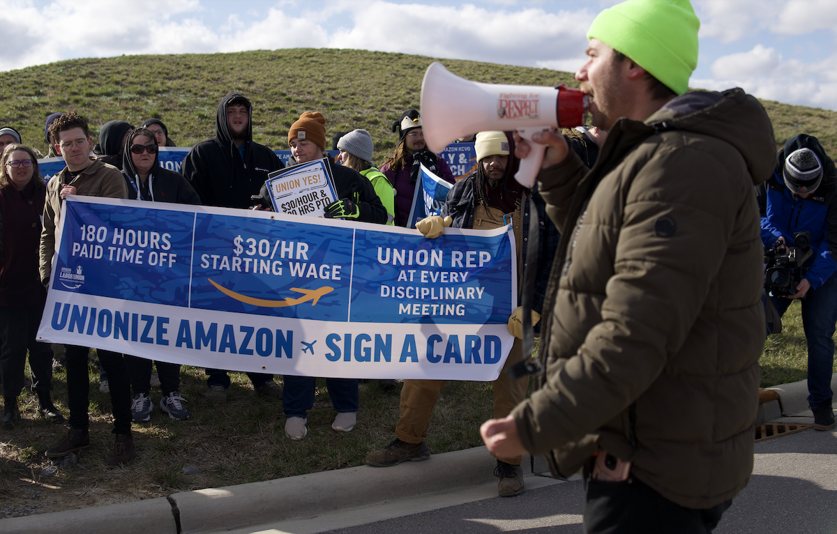 Amazon Air Hub union organizer Griffin Ritze addresses a crowd of Air Hub workers and supporters during a March 18 rally.