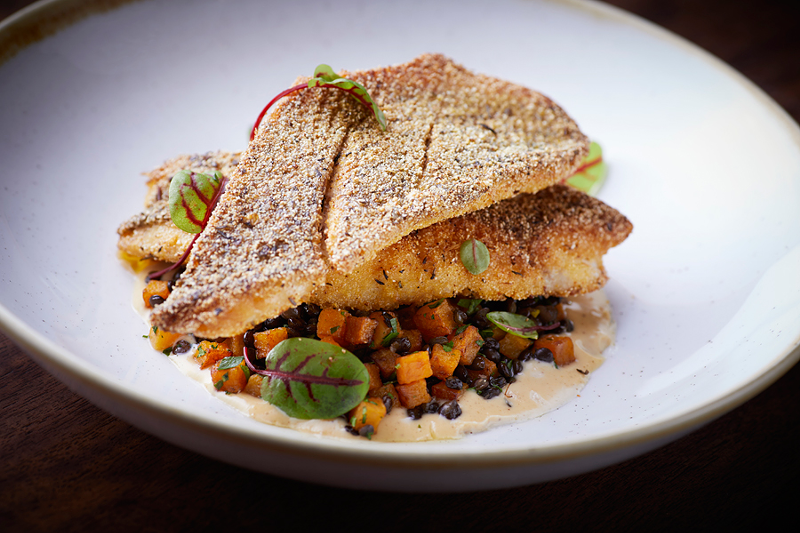 Coppin’s features local-meets-Southern-inspired dishes, like cornmeal-crusted striped bass. - Photo: Aparium Hotel Group