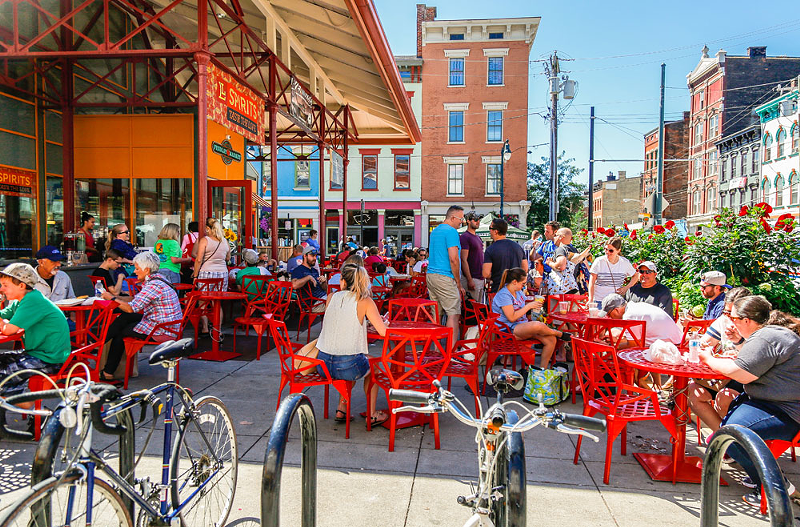 Findlay Market Biergarten's iconic red chairs are a perfect place to lounge and imbibe this spring and summer - PHOTO: HAILEY BOLLINGER