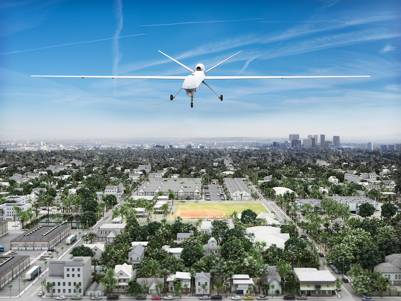 Surveillance UAV drone flying over a residential neighborhood - Photo: Shutterstock