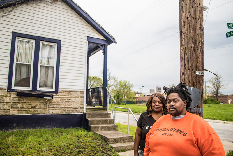Brandon Davis and his fiancée in front of the house they'd like to buy in Madisonville - Photo: Nick Swartsell