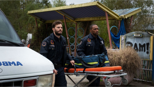 Paramedics Dennis (Jamie Dornan), left, and Steve (Anthony Mackie) take care of New Orleans' wounded, and each other, but they aren't prepared for where Synchronic will take them. - Photo: WELL GO USA ENTERTAINMENT