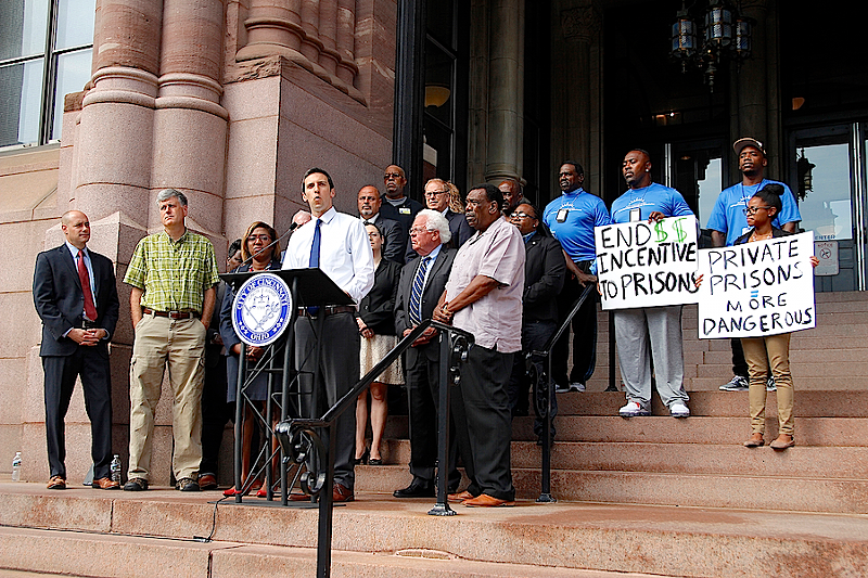 Council members P.G. Sittenfeld, Wendell Young, David Mann and Yvette Simpson and others announce a push to divest the city's pension funds from private prison companies at a news conference Aug. 30. - Nick Swartsell