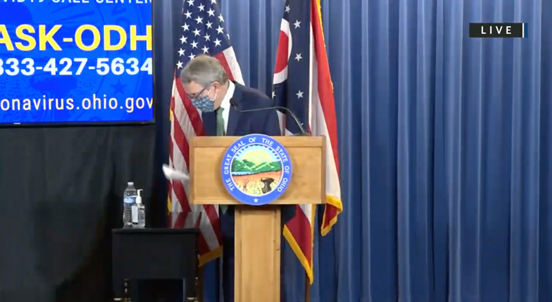 Ohio Gov. Mike DeWine removing his face mask before a press conference - Photo: Ohio Channel YouTube