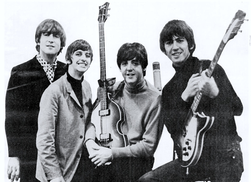 John Lennon is clearly dropping a secret clue about his future authorship of "In My Life" by smiling less than his bandmates in this photo from an ad congratulating them on their 1964 Grammy wins. - PHOTO: PUBLIC DOMAIN
