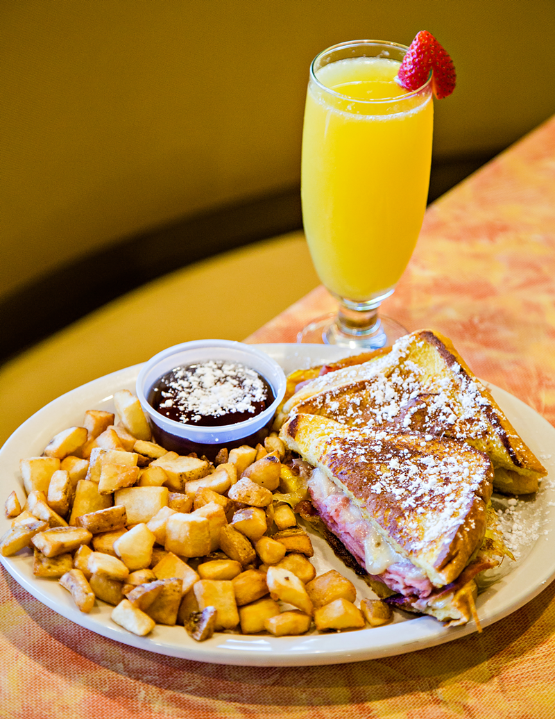 The Echo's Flying Pig Sandwich — Ham, bacon and Swiss cheese between two slices of French toast, topped with powdered sugar and syrup. - Photo: Hailey Bollinger