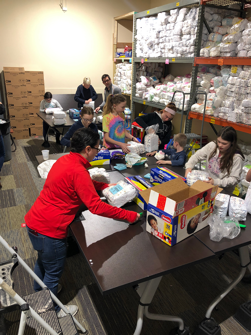 Busy workers at Sweet Cheeks Diaper Bank - PHOTO: Provided