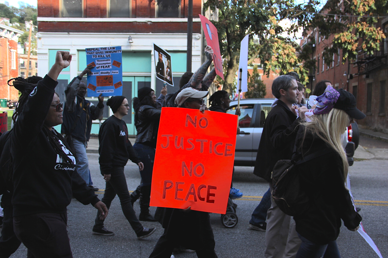 Protesters march down Vine Street ahead of the trial of Ray Tensing. - Nick Swartsell