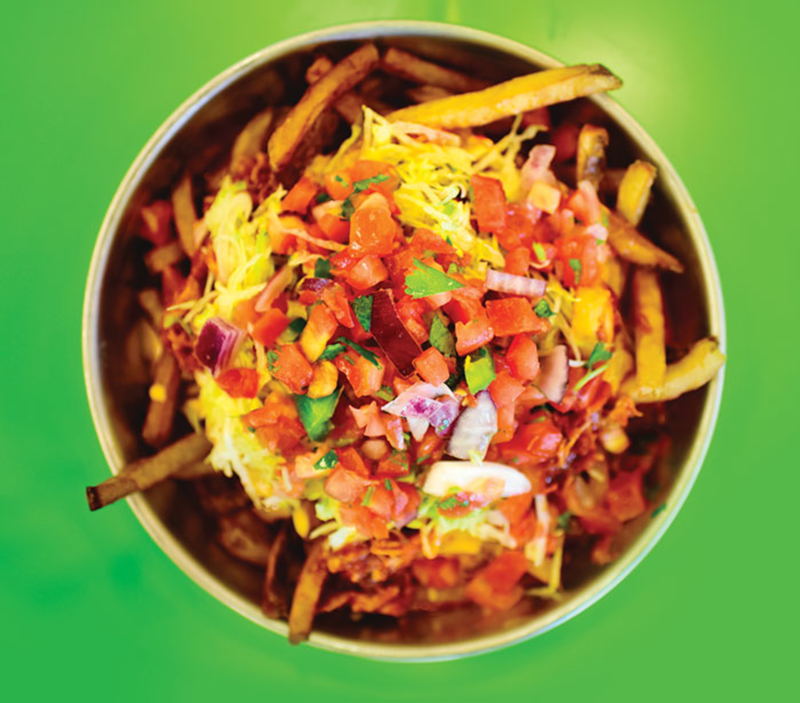 Chipotle chicken taco fries include chipotle and cheese sauces, lettuce and pico de gallo.