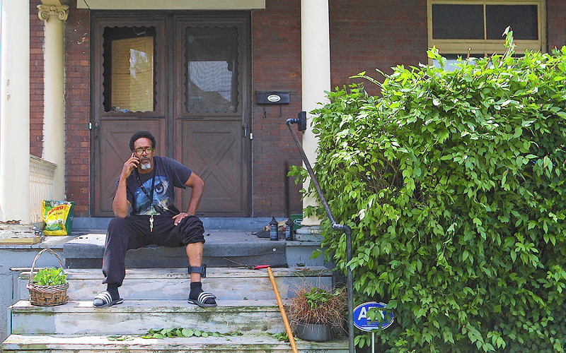 Earl Starr wears an electronic monitoring device and faces jail time due to repair orders - on his home in Evanston. - Photo: Nick Swartsell