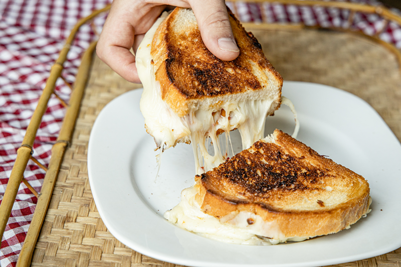 Share: Cheesebar's Bee Sting grilled cheese, with mozzarella, pepperoni, basil-infused honey and chili flakes on Tuscan pane - Photo: Hailey Bollinger