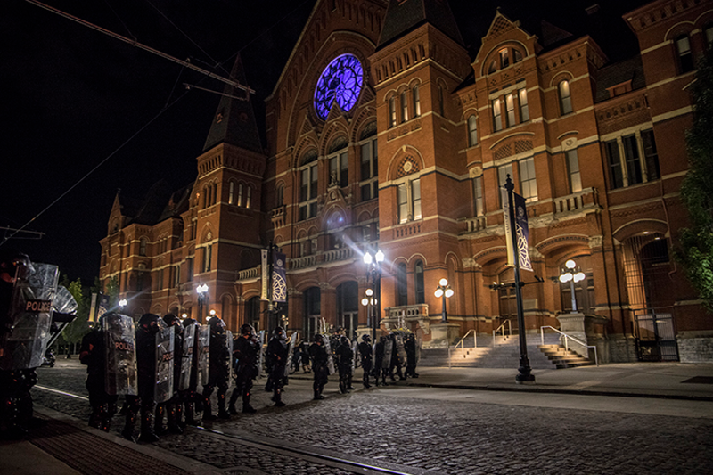 Cincinnati Police line up on Elm Street in front of Music Hall during protests over the death of George Floyd. - Nick Swartsell