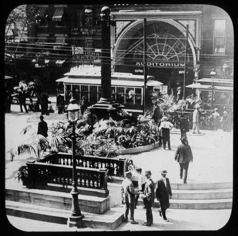 As depicted in one of the glass slides, a bustling Fountain Square cityscape, complete with a trolley car. - Courtesy of Public Library of Cincinnati and Hamilton County