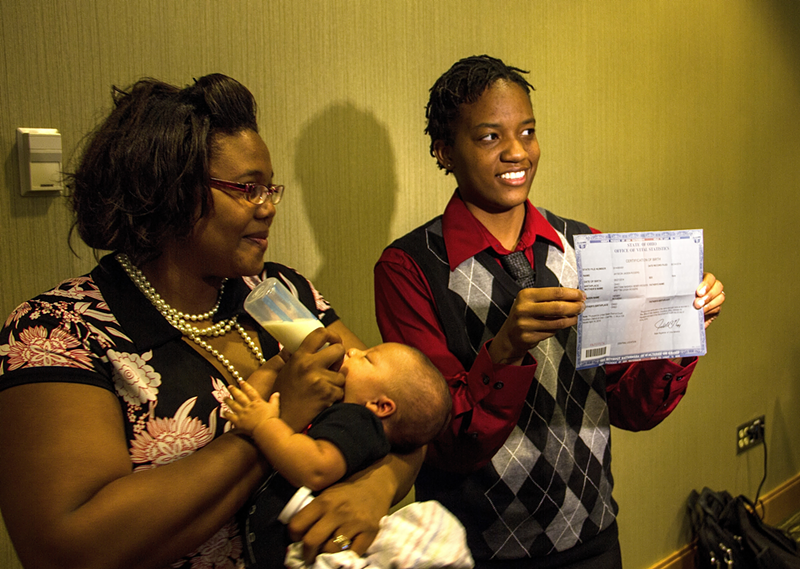 Brittani Henry-Rogers and Brittni Rogers display son Jayseon’s birth certificate. The Rogers are part of a suit to be heard April 28 by the U.S. Supreme Court over Ohio’s gay marriage ban.