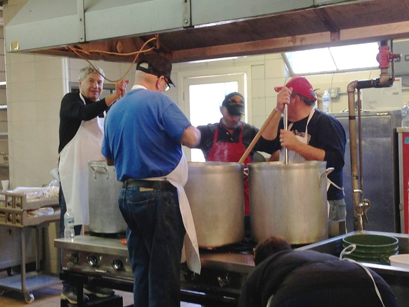 Looks like these guys are stirring vats of sauce - Photo: facebook.com/SacredHeartChurchCincy