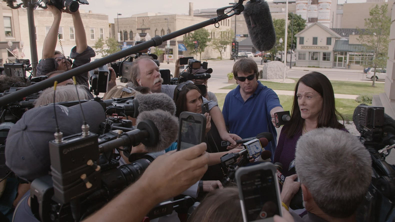 Kathleen Zellner, aka Steven Avery's attorney, surrounded by reporters. - Courtesy of Netflix