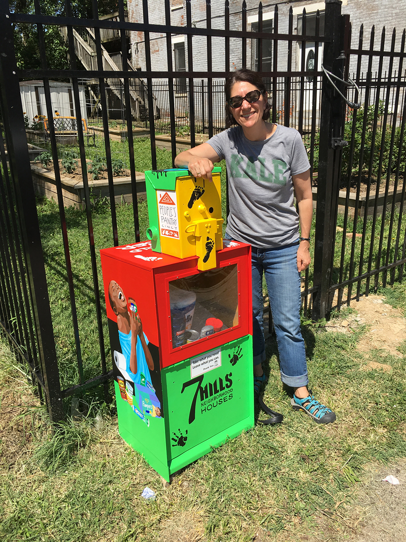Lisa Andrews with one of her newspaper boxes/food pantries - Photo: Provided