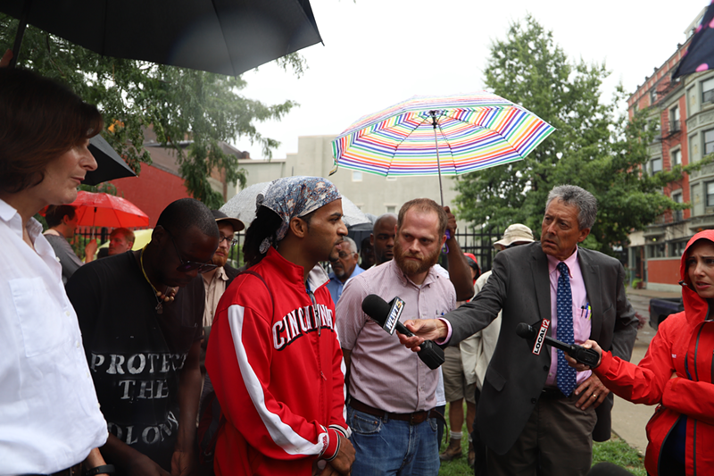 Joe Phillips speaks with reporters at a tent city on 13th Street - Nick Swartsell