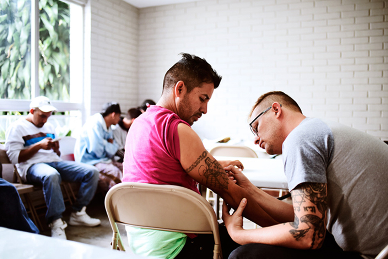 Jeremiah Griswold, owner of White Whale Tattoo, working on a cover-up for a former gang member in Guatemala - Photo: Jesse Fox