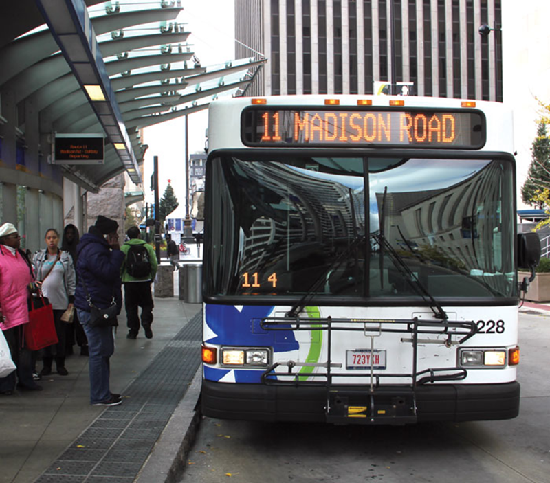 A Metro bus pulls into Government Square, the downtown hub for Cincinnati’s bus transit system.